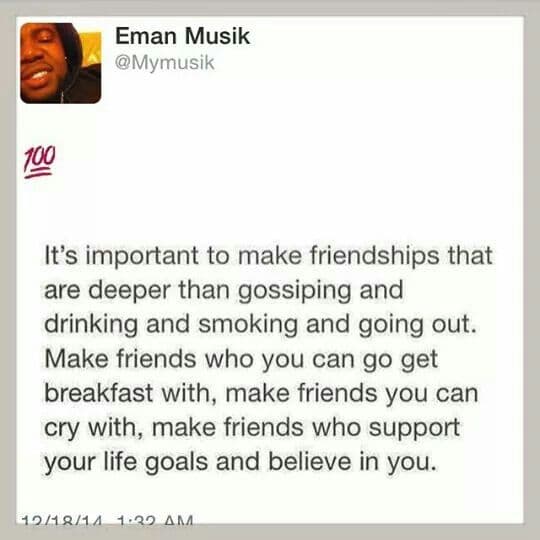 Group of diverse adults laughing together at an outdoor gathering