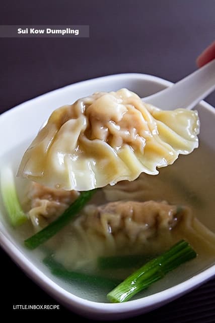 Futuristic gaming setup with glowing screens and controller