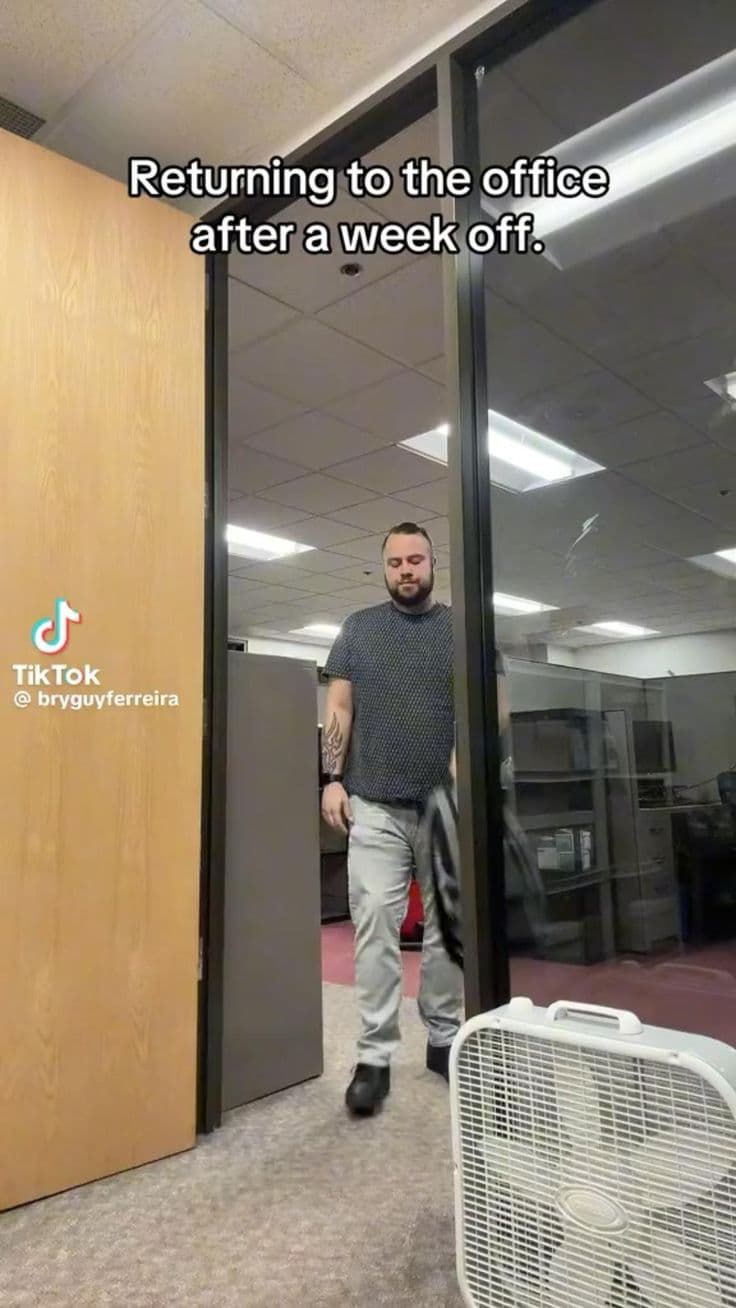 Empty office with rows of desks during return to office debate