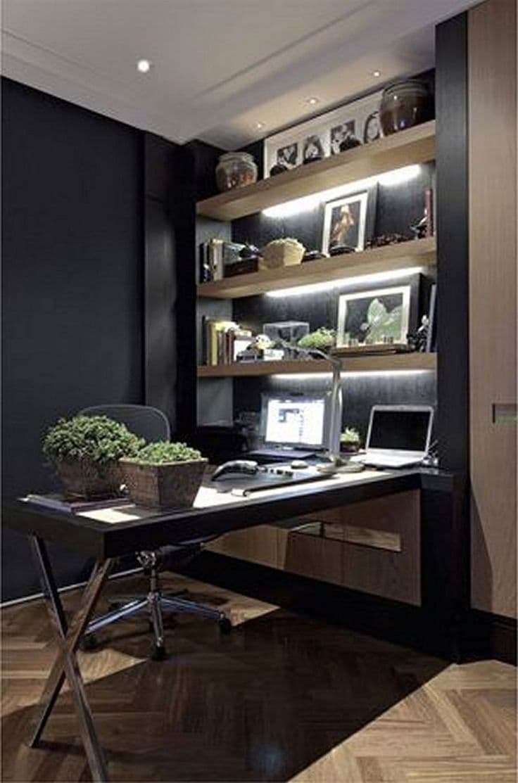 Modern home office with natural wood desk, ergonomic chair, and indoor plants by a window