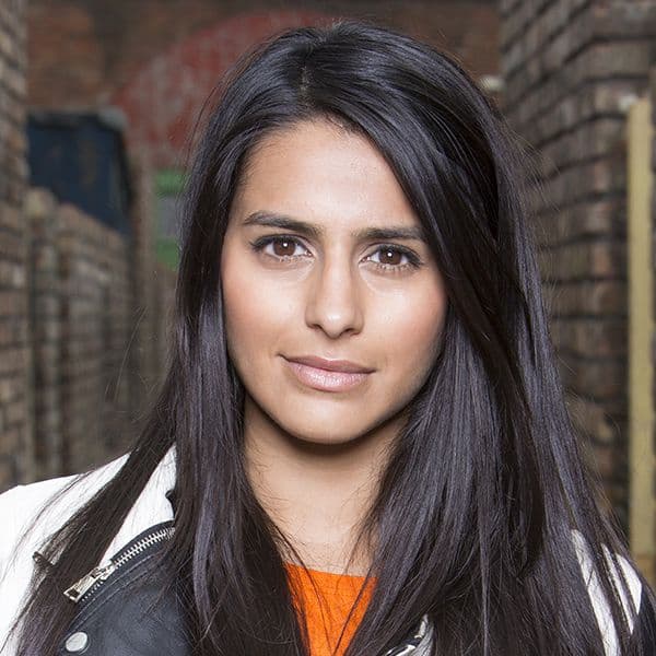 BBC journalist presenting news in a broadcast studio