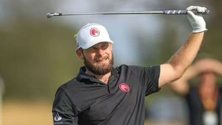 Professional golfer teeing off at a LIV Golf tournament event