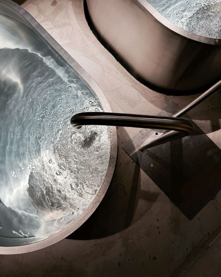 Person submerged in cold water ice bath therapy