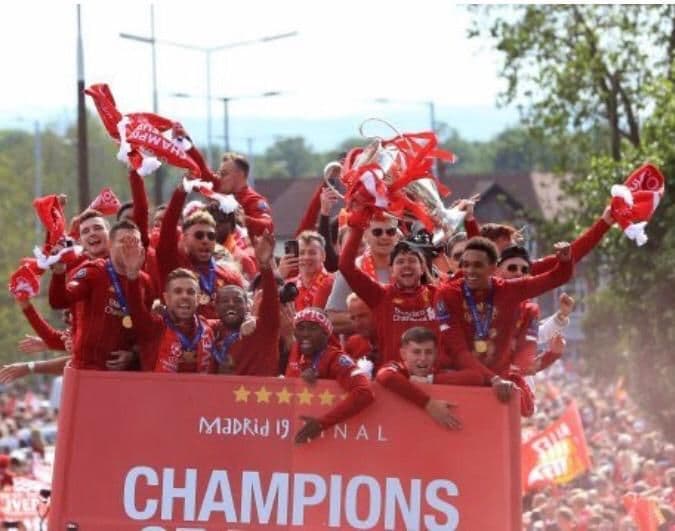 Premier League football match in packed stadium