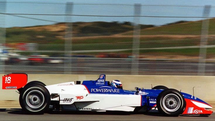 Formula 1 car racing on a circuit with motion blur