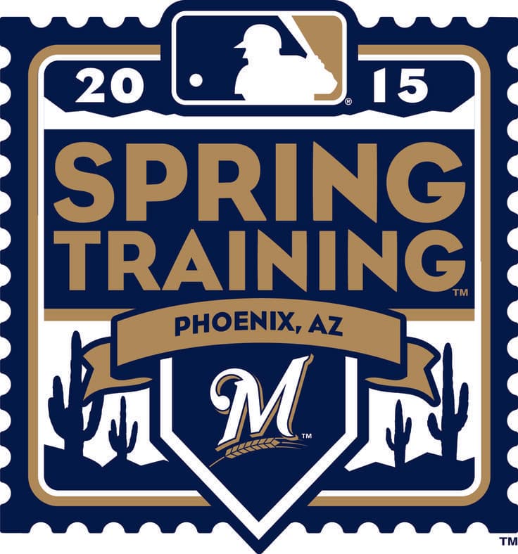 Baseball player at bat during a spring training game under clear blue skies