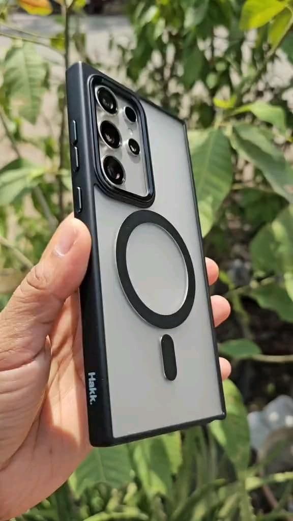 Close-up of a sleek smart ring on a finger against a neutral background