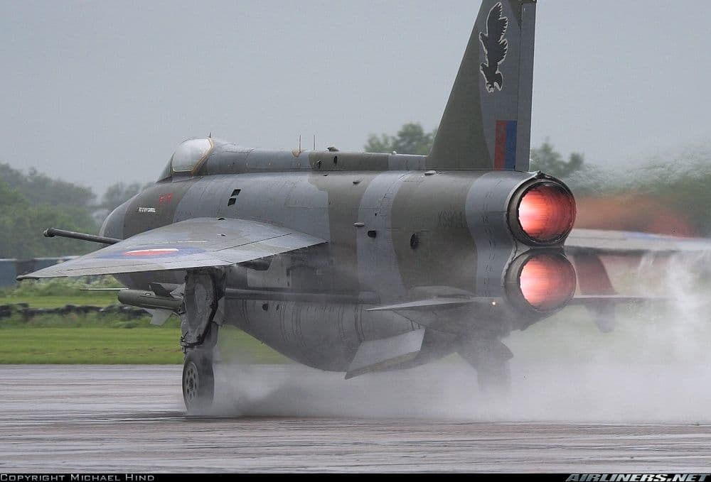 Small commercial airplane on runway at sunset