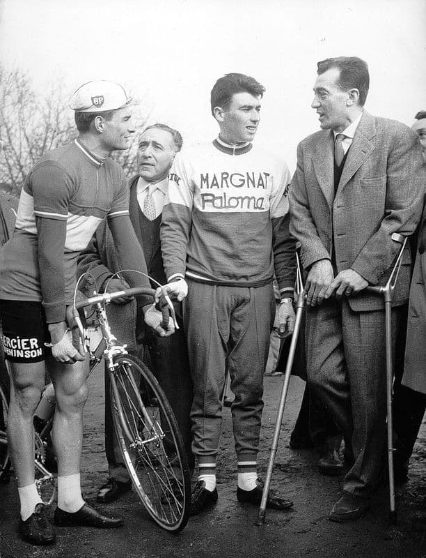 Professional cyclist climbing a steep mountain road during a race